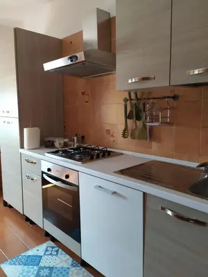 Cucina o angolo cottura di Casa Baddò, fronte spiaggia Air Con IUN R1866