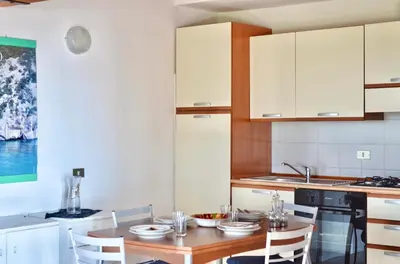 Cucina o angolo cottura di ISS Travel, Panoramic Coda Cavallo Cottages - 10 km from San Teodoro