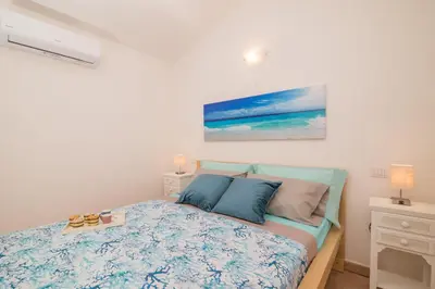 Letto o letti in una camera di Glori House 50m from Marina di Olbia - Happy Rentals