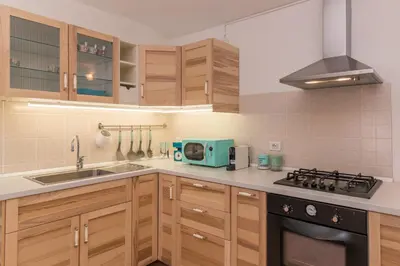 Cucina o angolo cottura di Glori House 50m from Marina di Olbia - Happy Rentals