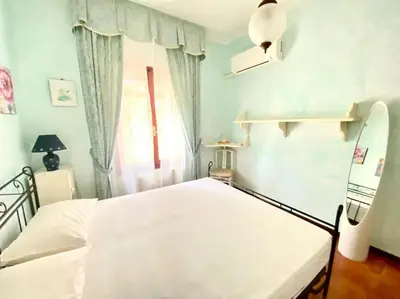 Letto o letti in una camera di Villa Fiorita