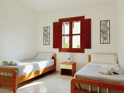 Letto o letti in una camera di La casa di Mara - Appartamento in zona residenziale a pochi minuti da Cala Liberotto