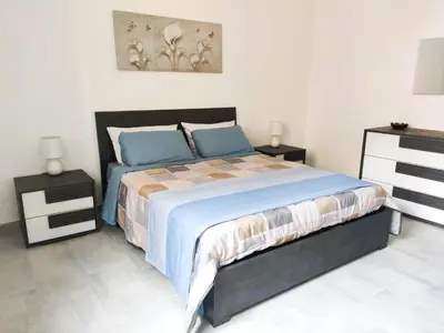 Letto o letti in una camera di Elsa e Anna Apartments - Comodi e Rilassanti Appartamenti
