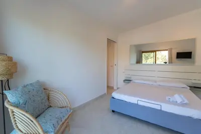 Letto o letti in una camera di THE BEACH