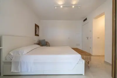 Letto o letti in una camera di THE BEACH