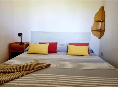 Letto o letti in una camera di SAN TEODORO CENTRO SPLENDIDO bilocale