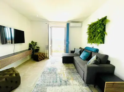 TV o dispositivi per l'intrattenimento presso Smeralda Sea View - Luxury Apartment