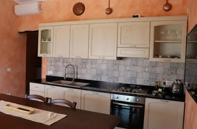 Cucina o angolo cottura di Country villa Sant' Elène - Appartamento Olivo
