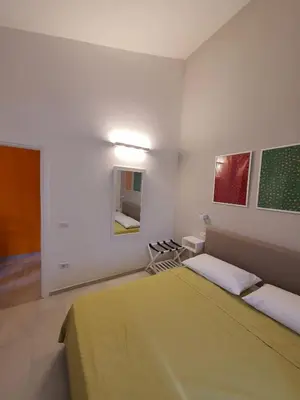 Letto o letti in una camera di Monolocale Porto Coda Cavallo