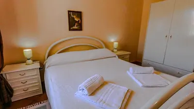 Letto o letti in una camera di Casa Vacanze Arianna