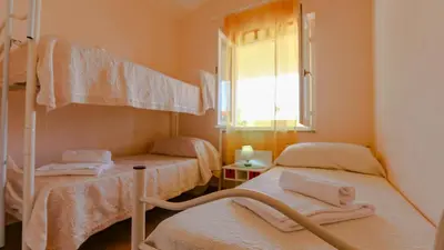 Letto o letti in una camera di Casa Vacanze Arianna