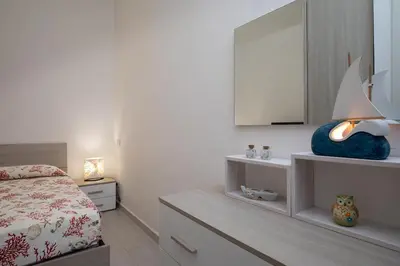 Letto o letti in una camera di Casa Perla by Wonderful Italy