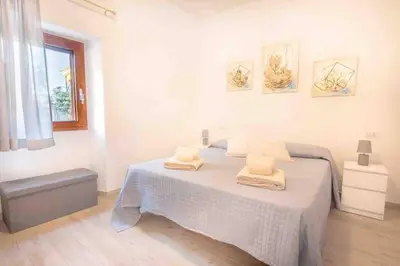 Letto o letti in una camera di Grazioso Monolocale a due passi dal centro