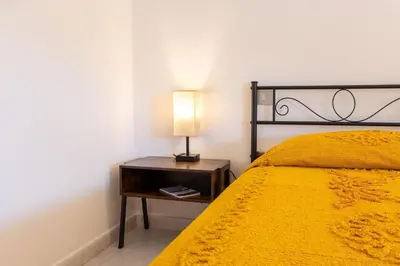 Letto o letti in una camera di Casa Elisa La Caletta
