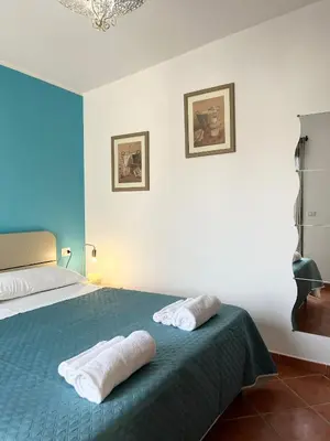 Letto o letti in una camera di Casa Mare e Sole IUN R2610