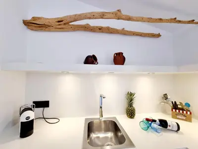 Cucina o angolo cottura di STAZZO SAN TEODORO IL GINEPRO Piscina Condivisa
