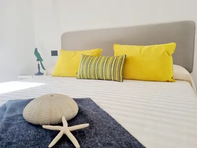 Letto o letti in una camera di STAZZO SAN TEODORO IL GINEPRO Piscina Condivisa