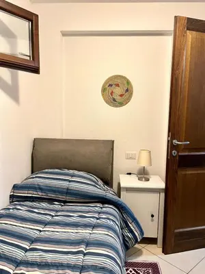 Letto o letti in una camera di Home and Life Olbia Holiday