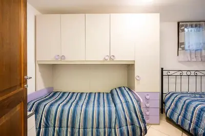 Letto o letti in una camera di Home and Life Olbia Holiday