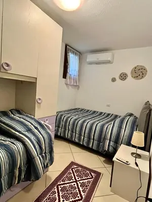 Letto o letti in una camera di Home and Life Olbia Holiday
