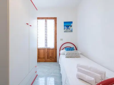 Letto o letti in una camera di CASA CELESTE CALA GONONE