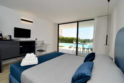 Letto o letti in una camera di Villa Almata