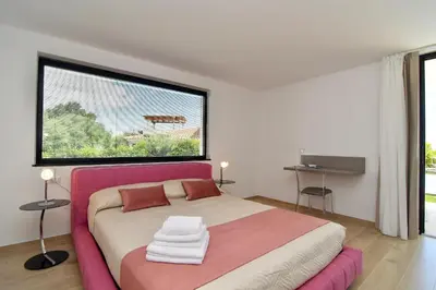 Letto o letti in una camera di Villa Almata