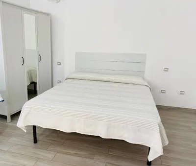 Letto o letti in una camera di Monolocale in Zona Centrale
