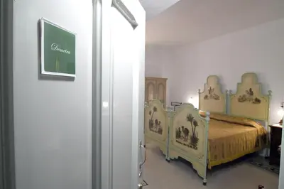 Letto o letti in una camera di Domo Peonia Bianca