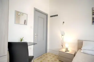 Letto o letti in una camera di helichrysum hospitality 85mq relax nel centro di olbia