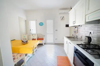 Cucina o angolo cottura di Sardinian Cottage, 150m from the sea, private Garden