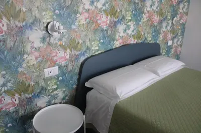 Letto o letti in una camera di LIDO DEL FARO