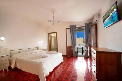 Letto o letti in una camera di S' Agrùstu