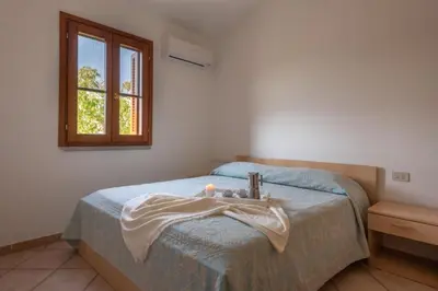 Letto o letti in una camera di Simple Gem of Le Dimore di Budoni 2 Bedroom Trilo6 Apartment sleeps 6 persons