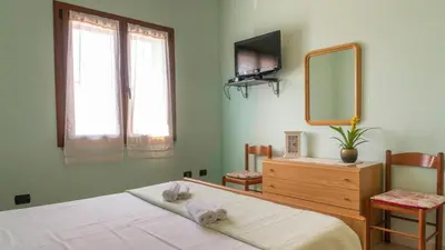 Letto o letti in una camera di Casa Su Lizu
