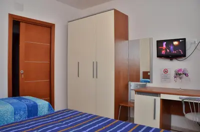 Letto o letti in una camera di Domo - Guest-House Il Nespolo Fiorito