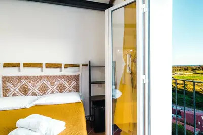 Letto o letti in una camera di CAMERA VISTA MARE CASA RAIMONDA Ammentos Posada