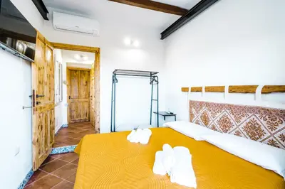 Letto o letti in una camera di CAMERA VISTA MARE CASA RAIMONDA Ammentos Posada