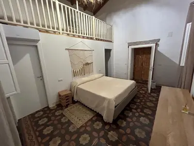 Letto o letti in una camera di Villa Aromata