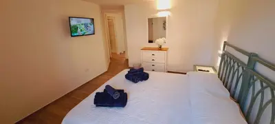 Letto o letti in una camera di San Teodoro Rooms