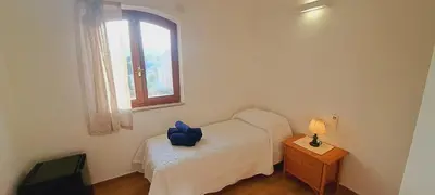 Letto o letti in una camera di San Teodoro Rooms