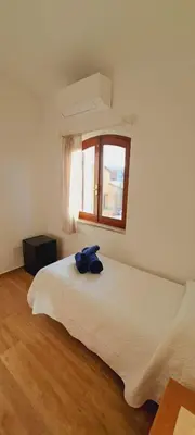 Letto o letti in una camera di San Teodoro Rooms