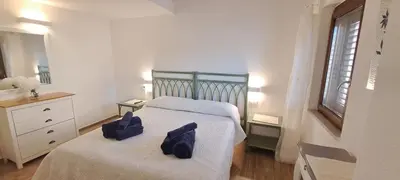 Letto o letti in una camera di San Teodoro Rooms