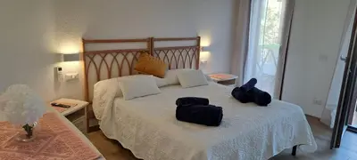Letto o letti in una camera di San Teodoro Rooms