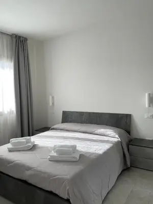Letto o letti in una camera di Olbios Apartment