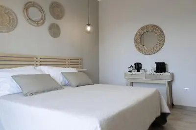 Letto o letti in una camera di Sunrise Sardinia Posada