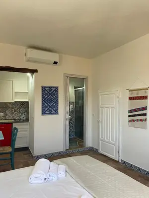Letto o letti in una camera di LOFT CON USO CUCINA E TERRAZZO PANORAMICO - FORA E' MUROS II - Ammentos Posada