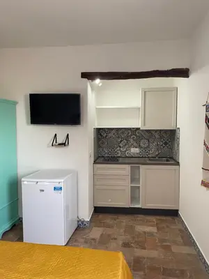 Cucina o angolo cottura di LOFT CON USO CUCINA E TERRAZZO PANORAMICO - FORA E' MUROS II - Ammentos Posada