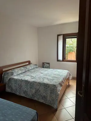 Letto o letti in una camera di Trilocale i Fenicotteri