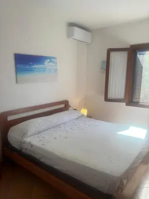 Letto o letti in una camera di Trilocale i Fenicotteri